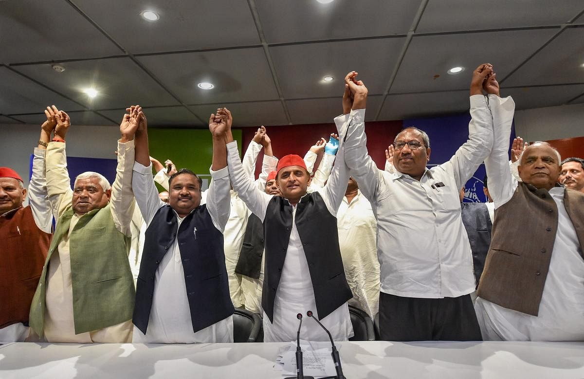 Samajwadi Party President Akhilesh Yadav, Nishad Party President Sanjay Nishad and Janwadi Party (Socialist) President Sanjay Singh Chauhan during a joint press conference at the party office, in Lucknow, Tuesday, March 26, 2019. (PTI Photo)