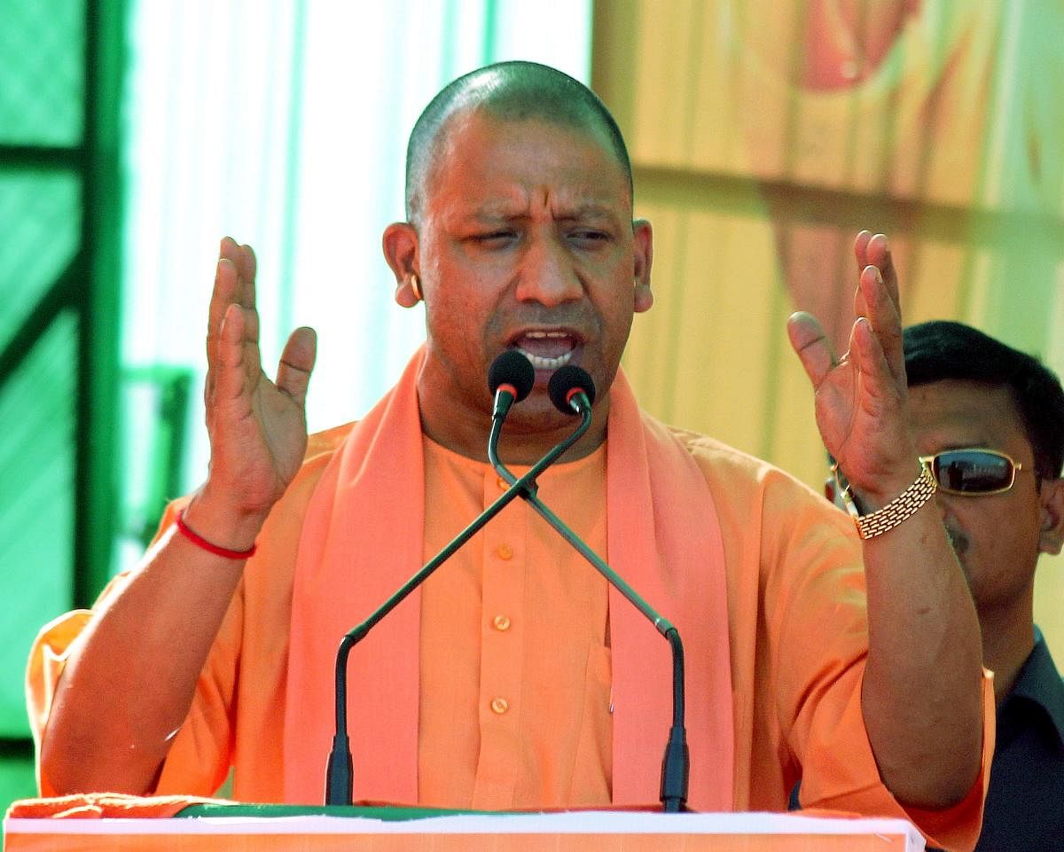 "Shame!," said Adityanath, condemning Khan's remark and the two former chief ministers' silence over the jibe. PTI File photo
