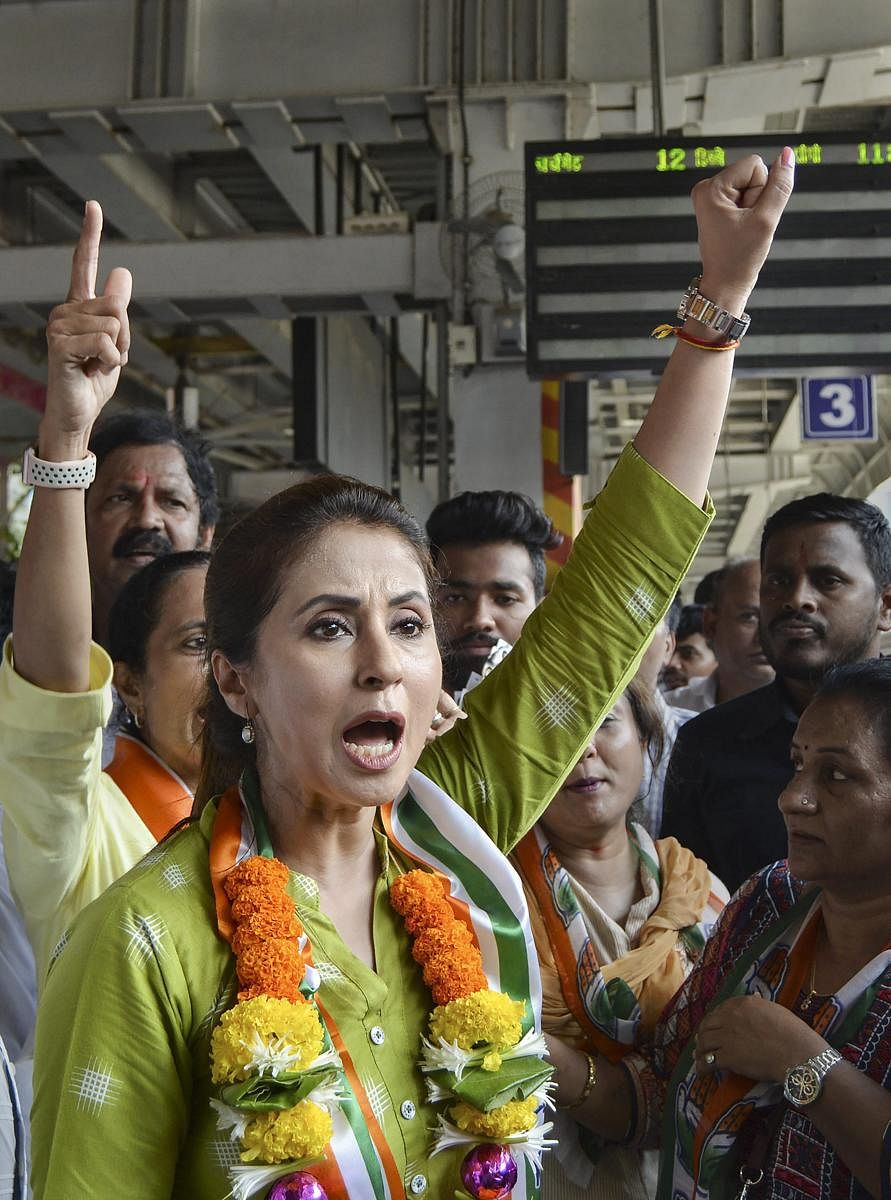 Bollywood actress and Congress candidate Urmila Matondkar campaigns for the Lok Sabha polls at Borivali Station, in Mumbai, Monday, April 15, 2019. PTI Photo