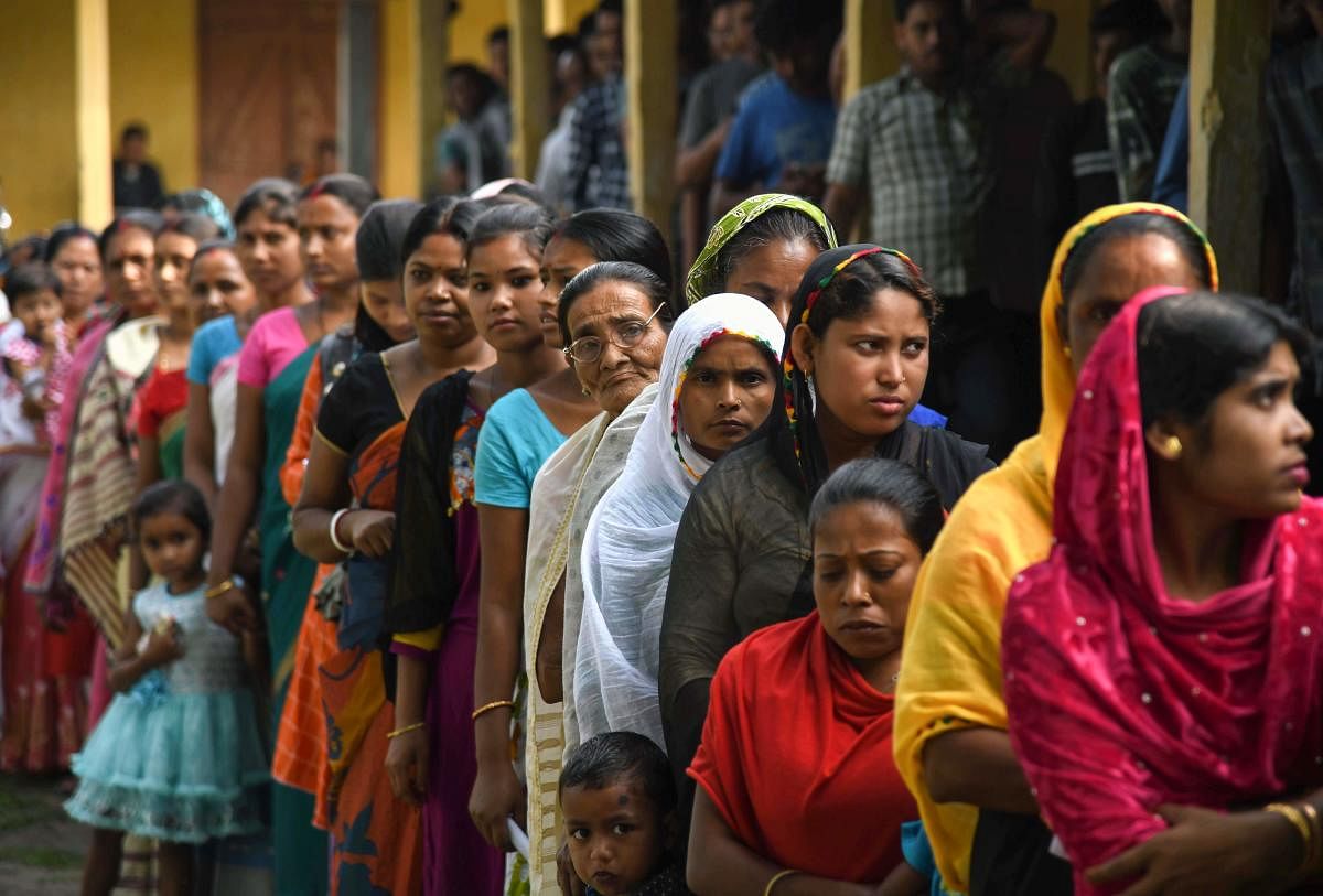 Indian women line up to cast their votes at a polling station during the second phase of the mammoth Indian elections in Patidarang village, some 60km from Guwahati, on April 18, 2019. AFP photo