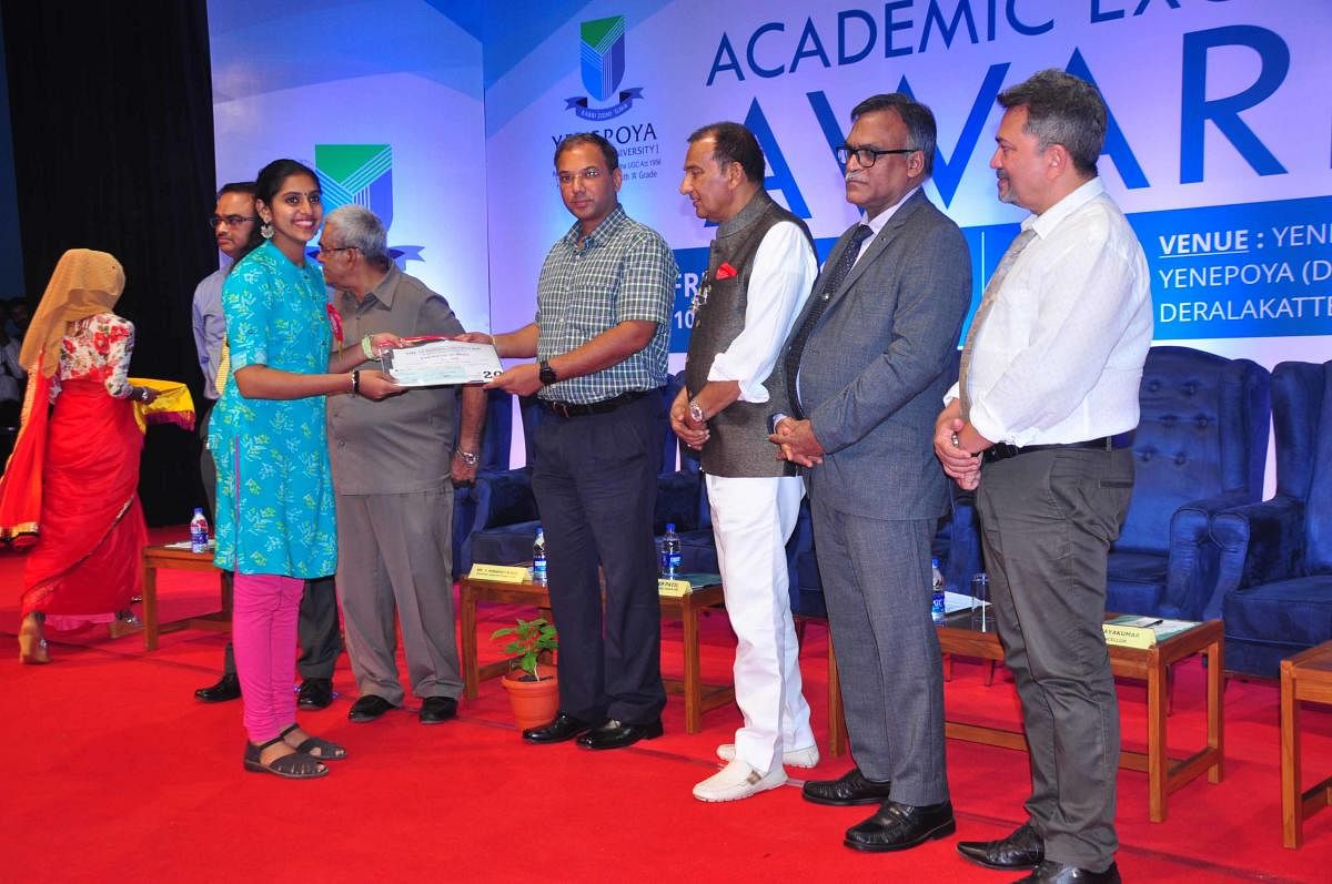 City Police Commissioner Sandeep Patil presents the Academic Excellence Awards to a student in Mangaluru on Friday.