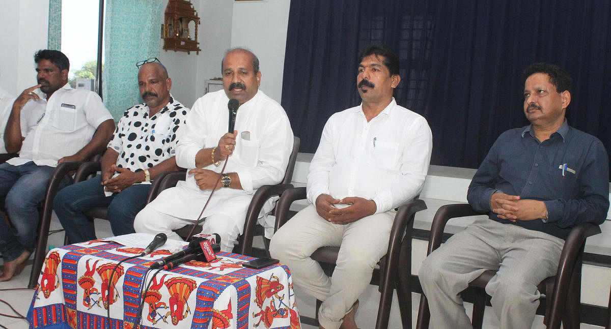 MLA Raghupathi Bhat speaks at a press conference.