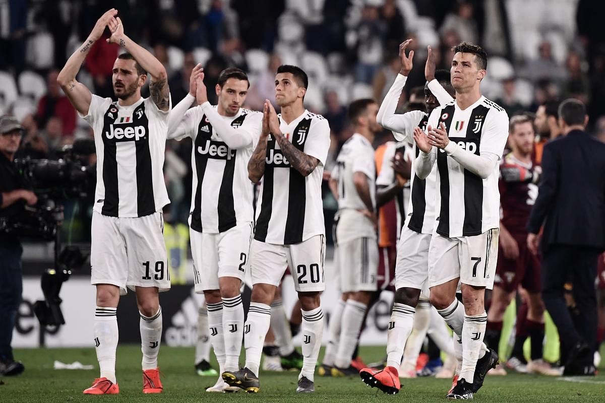 Juventus' Portuguese forward Cristiano Ronaldo (R) reacts at the end of the Italian Serie A football match Juventus vs Torino. AFP