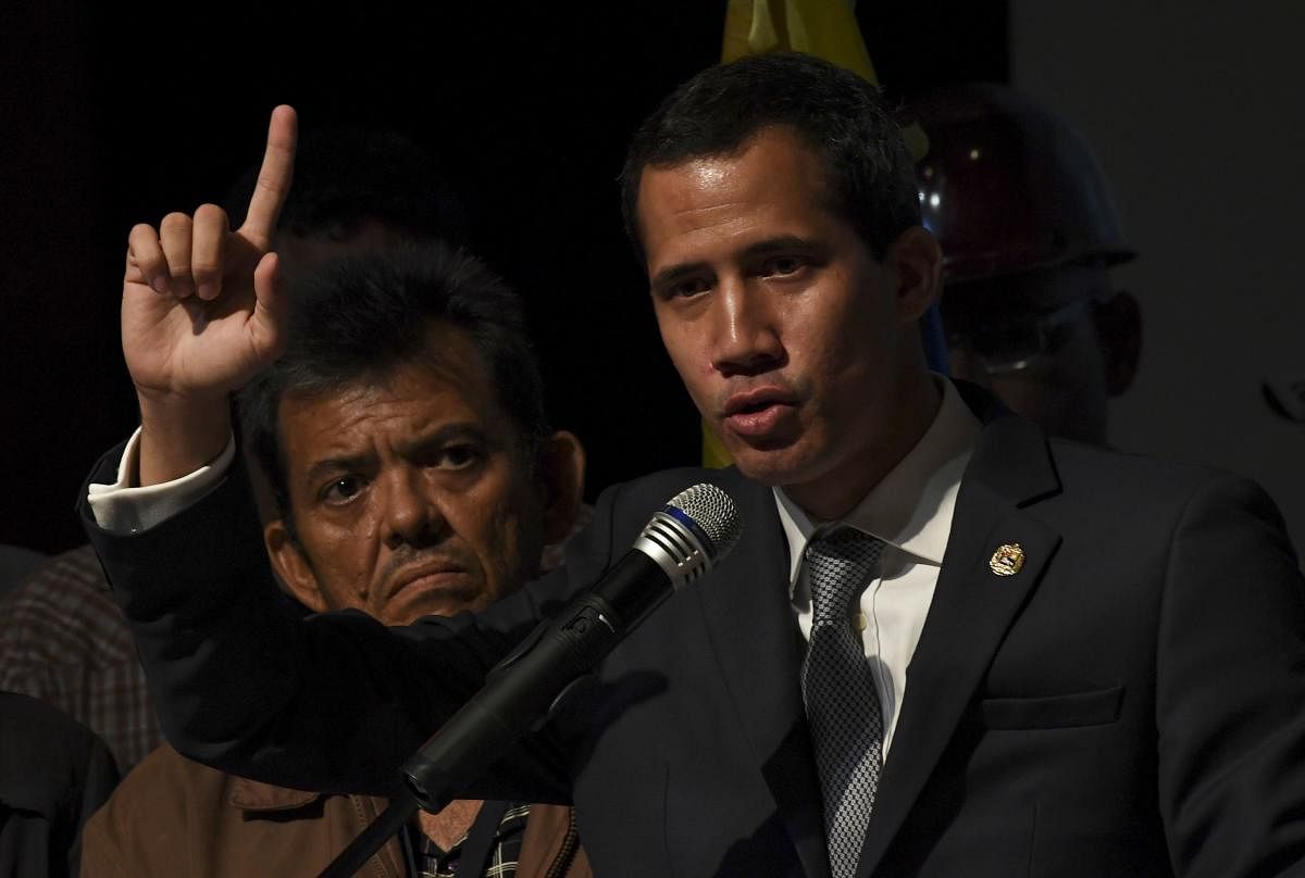 Venezuelan opposition leader and self-proclaimed acting president Juan Guaido speaks during a meeting with a group of workers of the state oil company of Venezuela. AFP