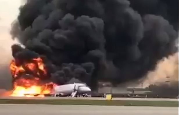 Russian television showed huge black columns of smoke towering over the plane. (Video grab)