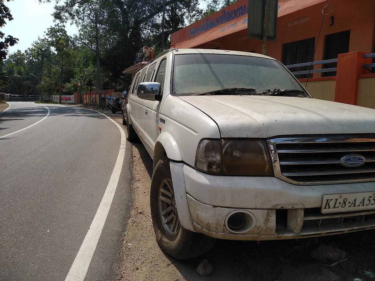 A luxury car damaged in the floods that hit Kerala last year lies abandoned on the Aaranmula-Chengannur road.