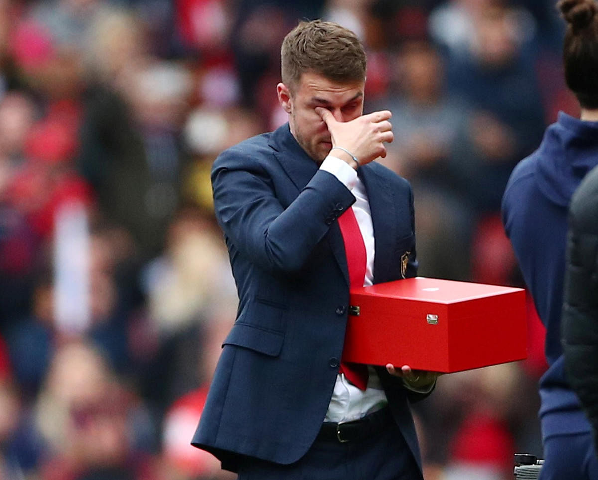 Arsenal's Aaron Ramsey can't control his tears while bidding farewell to the club on Sunday. REUTERS