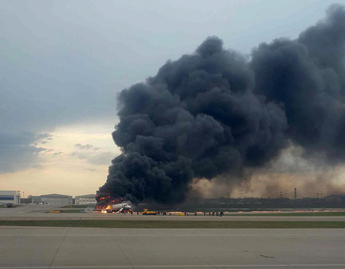 A passenger plane is seen on fire after an emergency landing at the Sheremetyevo Airport outside Moscow, Russia May 5, 2019. REUTERS/Nadezhda Polomoshnova.