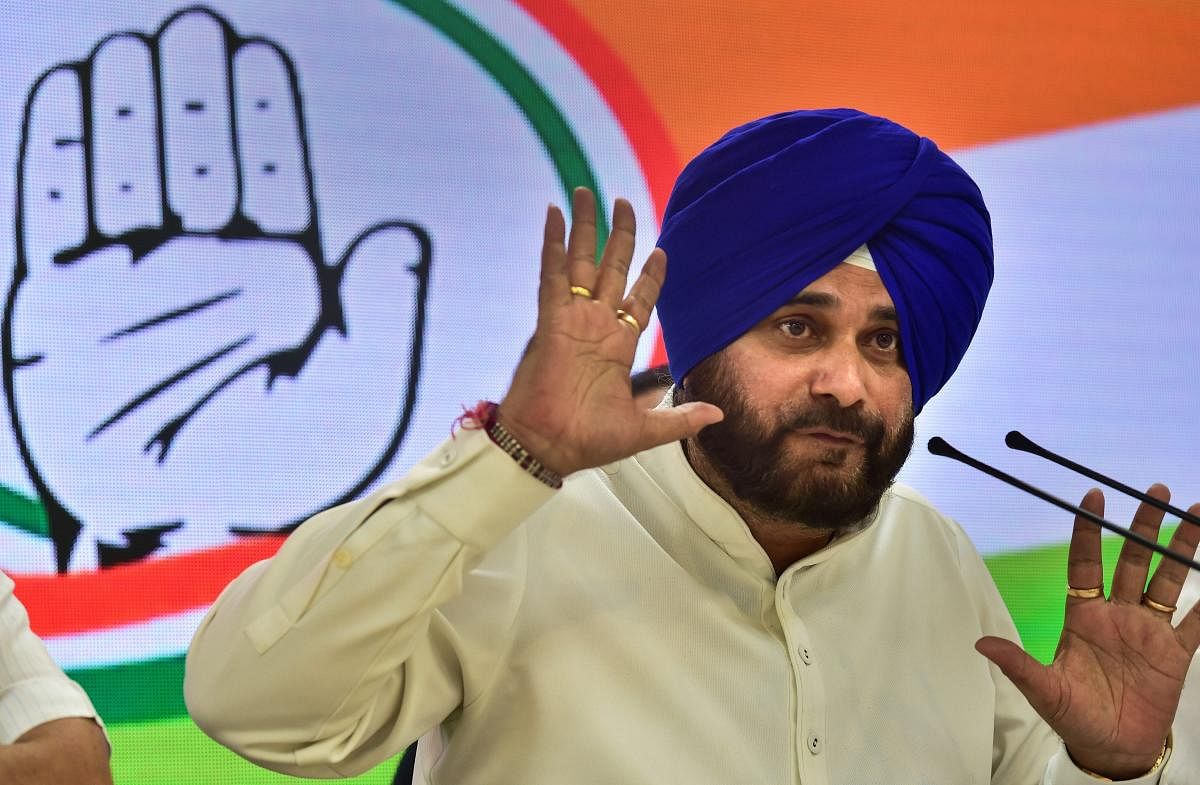Addressing a press conference at the Congress headquarters here, party leader Navjot Singh Sidhu shared details about various schemes of the BJP government. PTI File photo