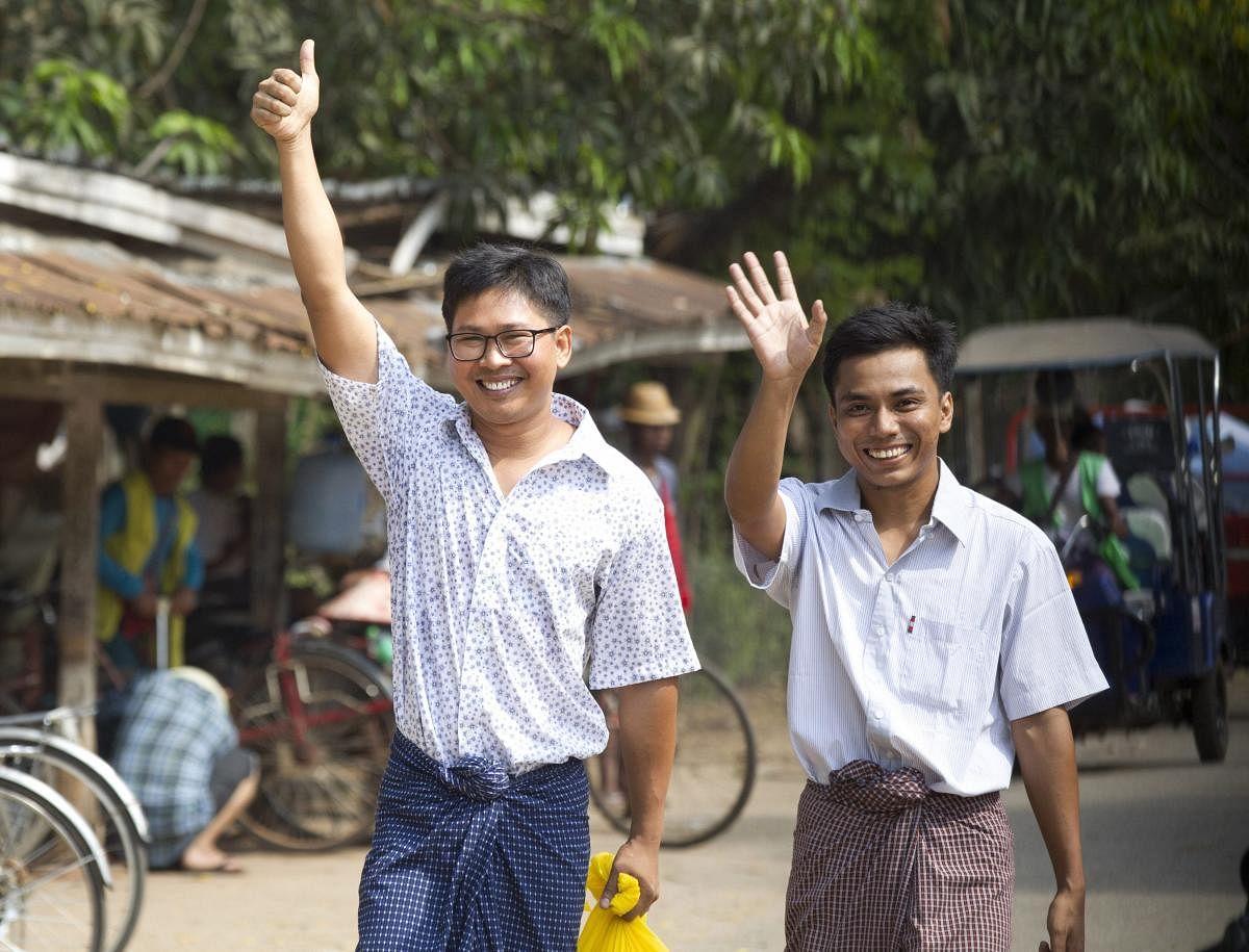 Reuters journalists Wa Lone, left, and Kyaw She Oo wave as they walk out from Insein Prison after being released in Yangon, Myanmar Tuesday, May 7, 2019. (AP/PTI)