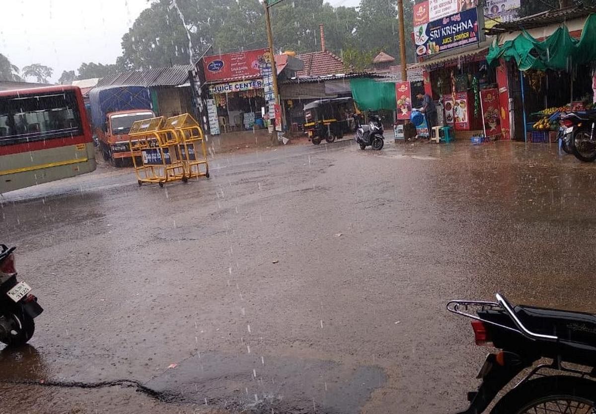 Naravi in Beltangady taluk of Dakhina Kannada district received copious rains. (Right) Suntikoppa in Kodagu district received rain on Tuesday evening. DH Photo