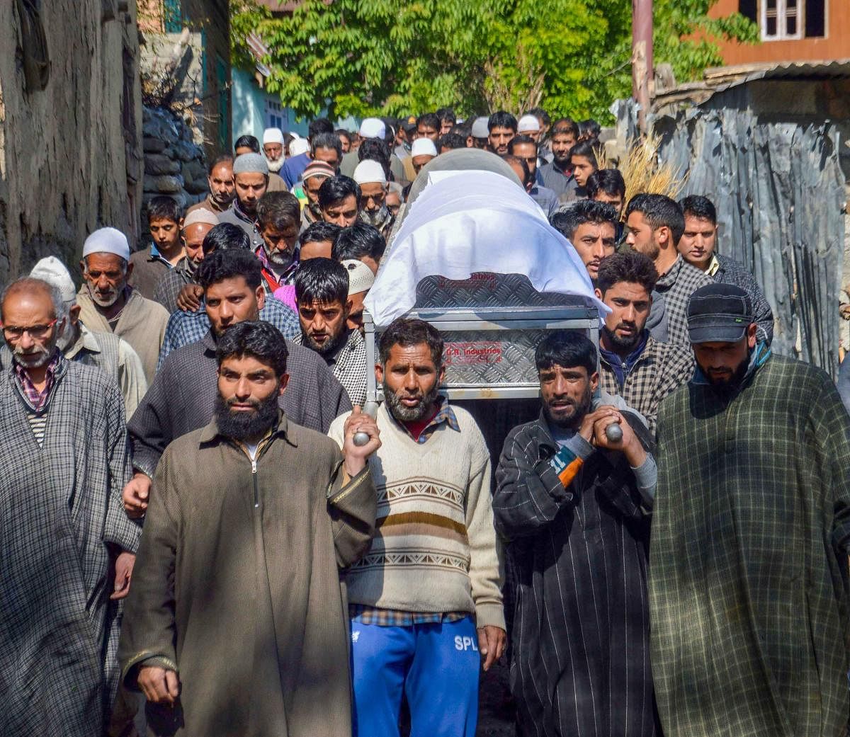 People carry the body of BJP state vice-president Ghulam Mohammad Mir during his funeral procession in Veerinag area of Anantnag district, J & K, Sunday, May 5, 2019., Mir was killed by the suspected militants. (PTI Photo)