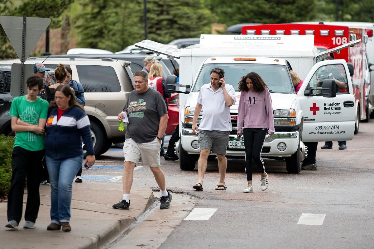 Parents pick up their children from the Recreation Center at Northridge in Highlands Ranch after a shooting at the STEM School Highlands Ranch, Colorado on May 7, 2019. - At least seven students were wounded on May 7 in a school shooting in the US state o
