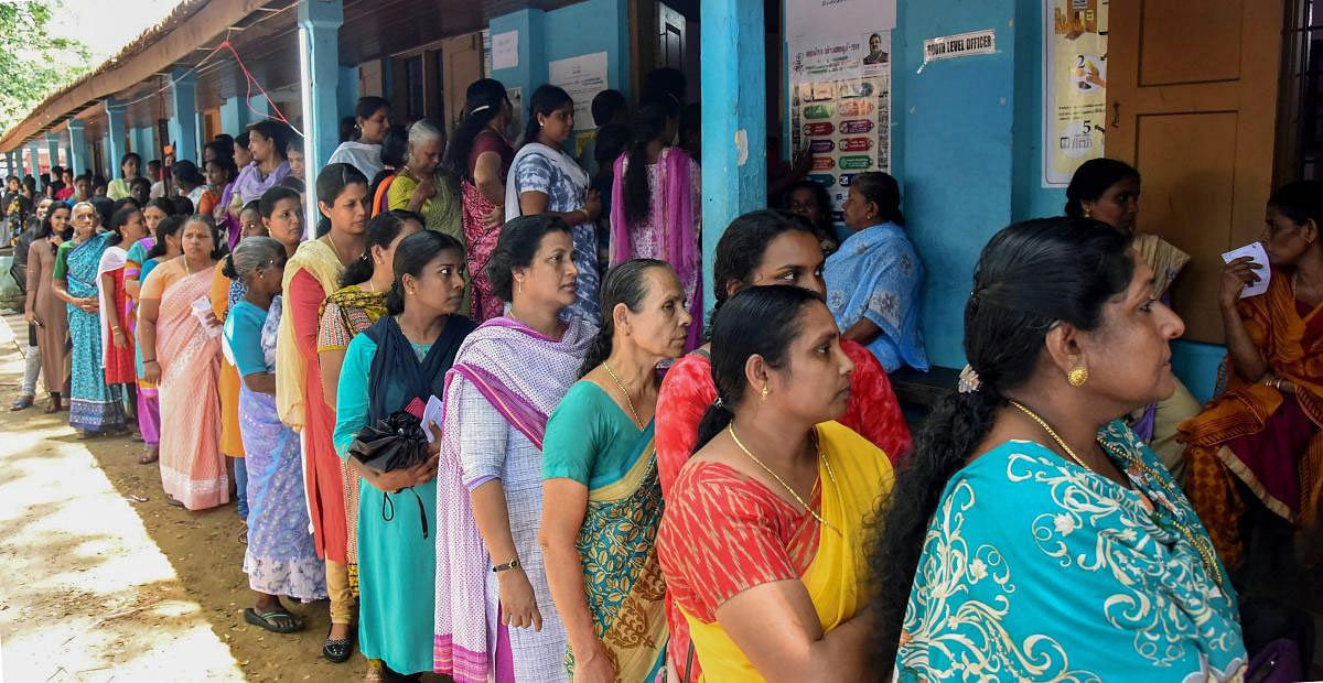 Voters queue up to cast their votes at a polling station, during the third phase of the 2019 Lok Sabha polls, in Kochi, Tuesday, April 23, 2019. (PTI Photo)