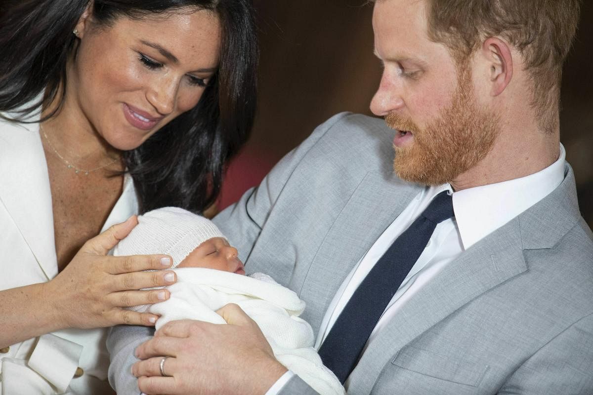 Britain's Prince Harry and Meghan, Duchess of Sussex, during a photocall with their newborn son, in St George's Hall at Windsor Castle. (AP/PTI Photo)