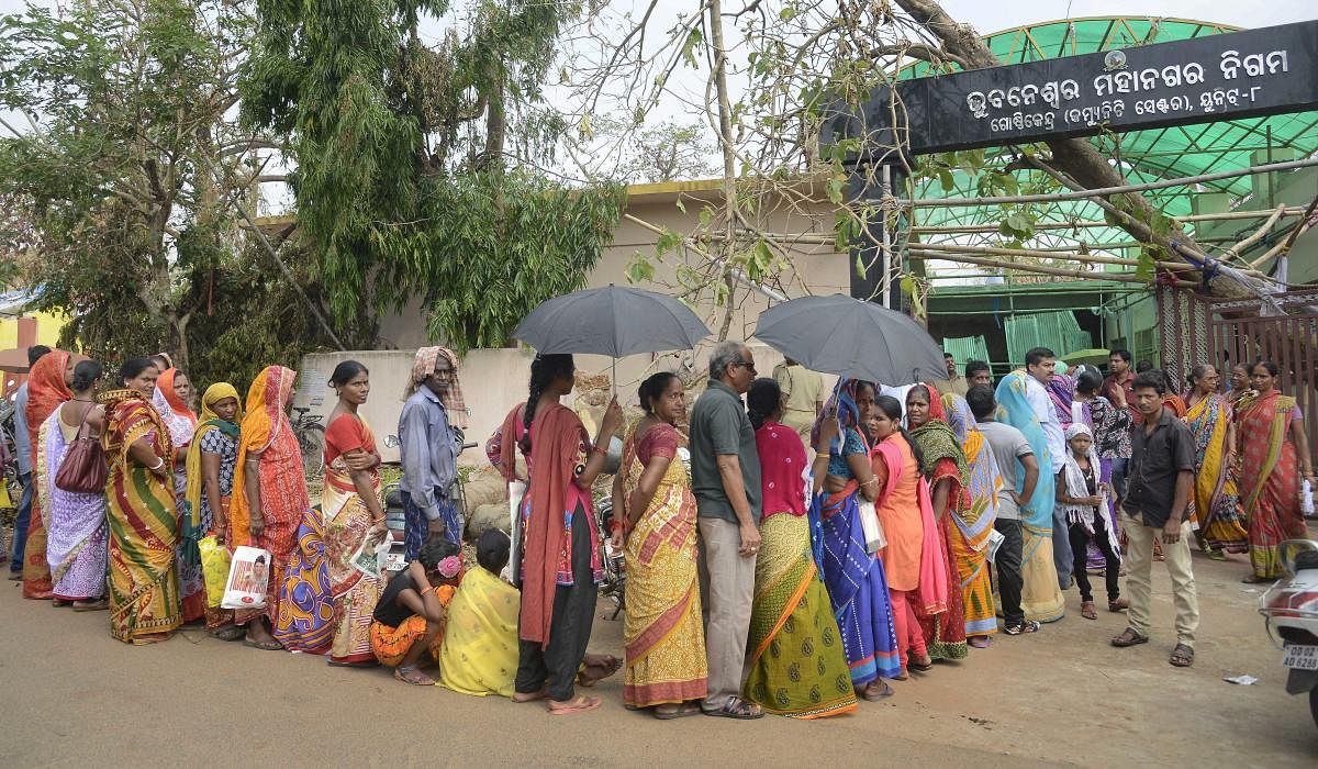 Victims of Cyclone Fani queue up outside a relief material distribution centre, in Bhubaneswar, on Thursday, May 9, 2019. PTI