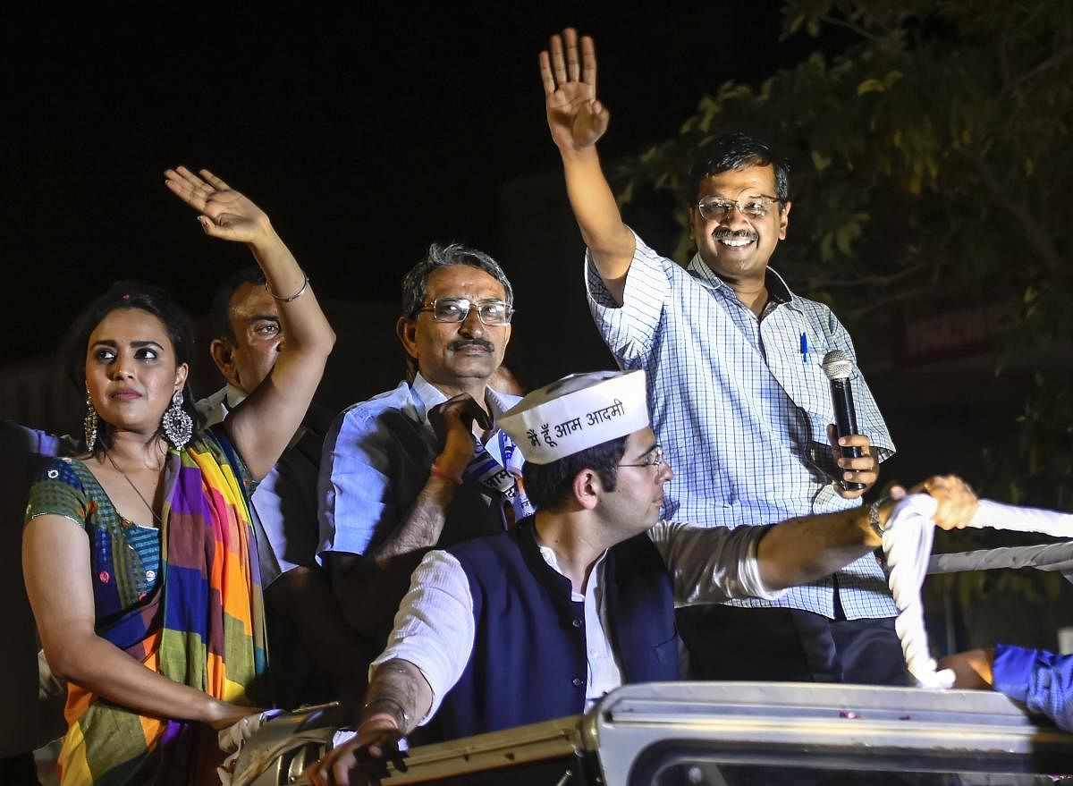 Delhi Chief Minister Arvind Kejriwal waves at his supporters during a roadshow in support of AAP party candidate from South Delhi constituency Raghav Chadha, for the ongoing Lok Sabha polls, at Chhatarpur, in New Delhi. (PTI Photo)