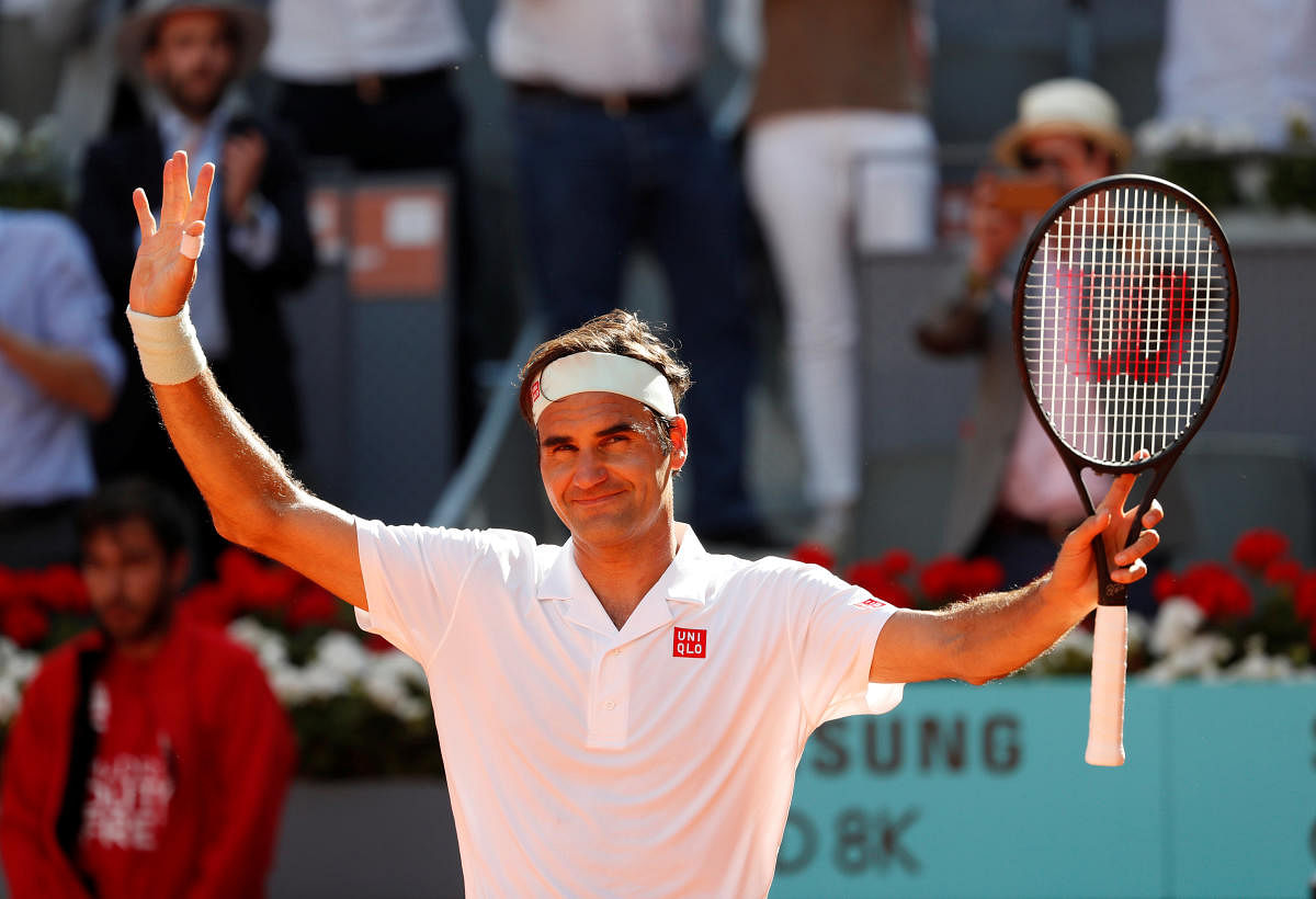 Switzerland's Roger Federer celebrates winning his third round match against France's Gael Monfils. Reuters photo