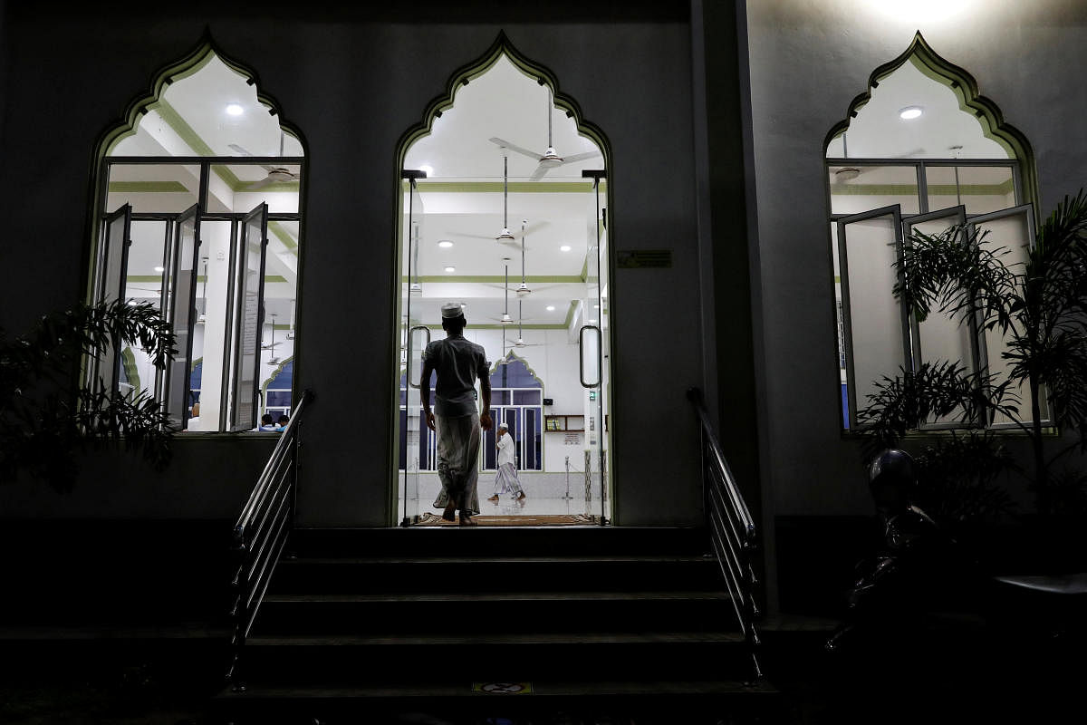 Muslims arrive at a mosque for evening prayers in Kattankudy, Sri Lanka. Reuters file photo
