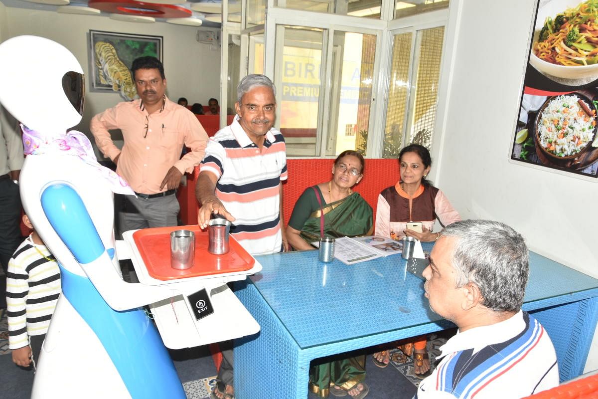 A humanoid robot serving the customers at a restaurant in Shivamogga.