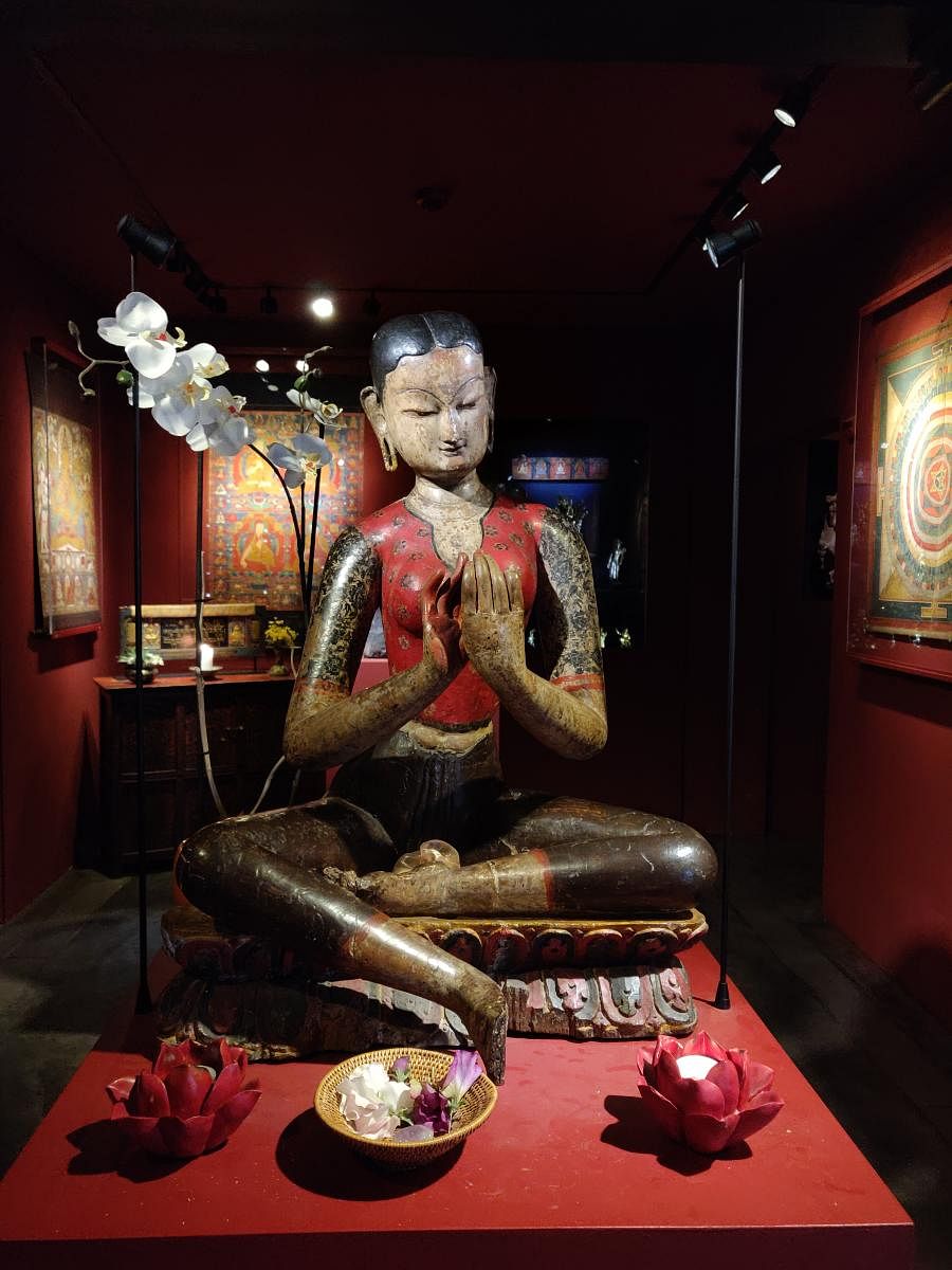 Statue of goddess Mahasri Tara in Tibet museum; the Vajra; objects of worship in the museum. Photos by author