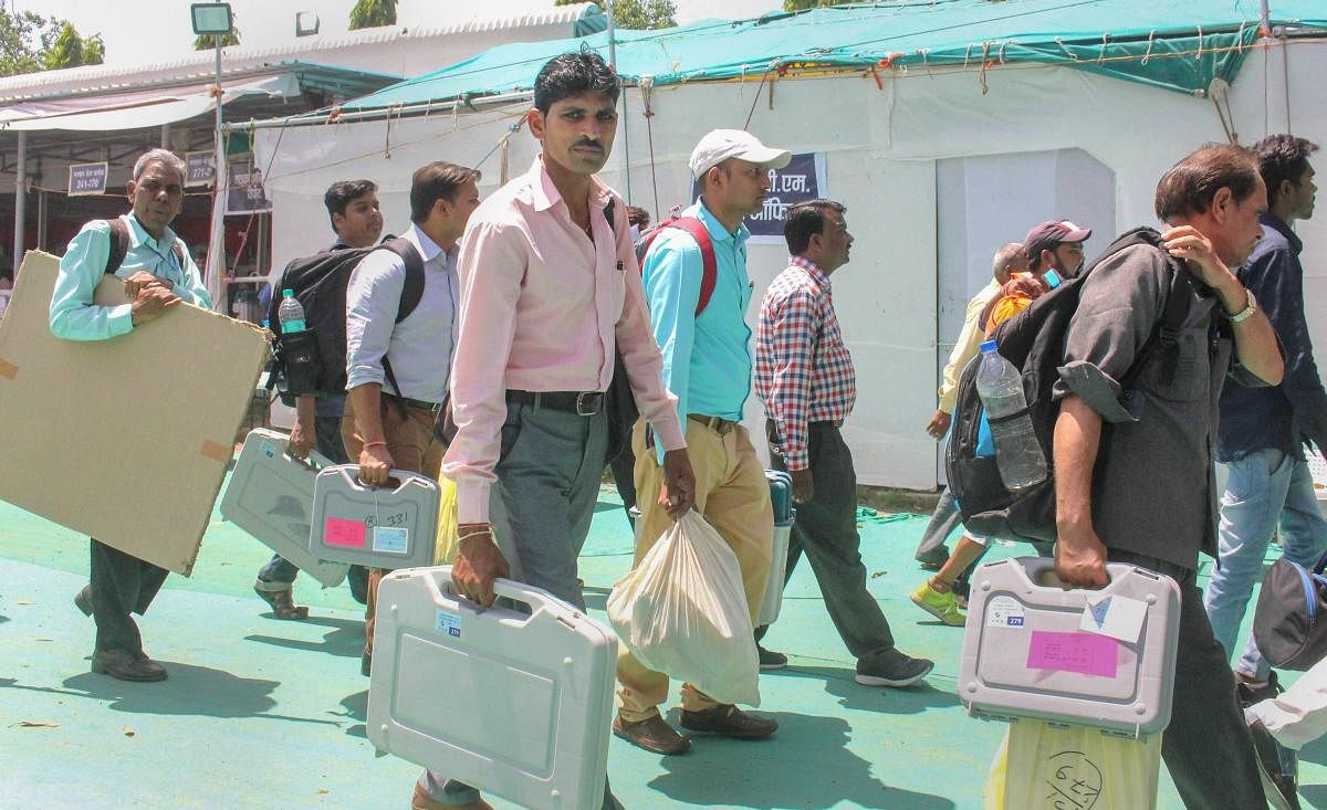Bhopal: Election officials leave after collecting VVPAT, EVMs and other polling materials from collection centres ahead of the sixth phase of Lok Sabha polls, in Bhopal, Saturday, May 11, 2019 (PTI Photo) (PTI5_11_2019_000030B)