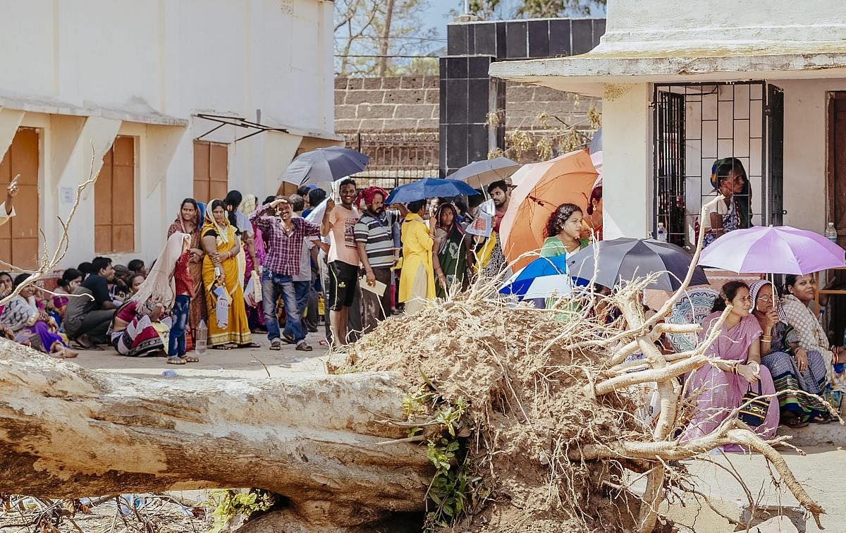 Cyclone Fani affected people wait to receive relief material being distributed by the Odisha government, in Bhubaneswar, Saturday, May 11, 2019. (PTI Photo) 