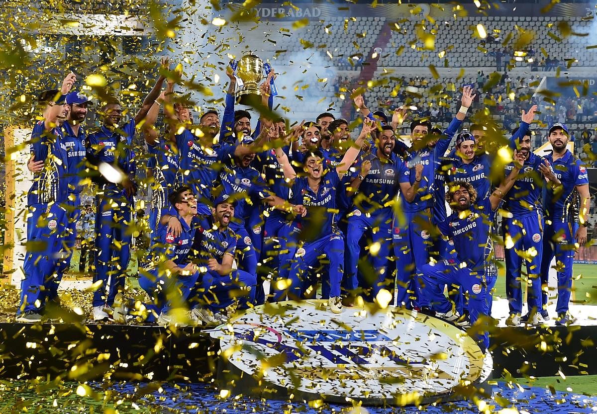 Mumbai Indians (MI) skipper Rohit Sharma with his teammates celebrating with Indian Premier League 2019 winning trophy after win over Chennai Super Kings (CSK) at the Final cricket match at Rajiv Gandhi International Cricket Stadium in Hyderabad, Monday, May 13, 2019. (PTI Photo)