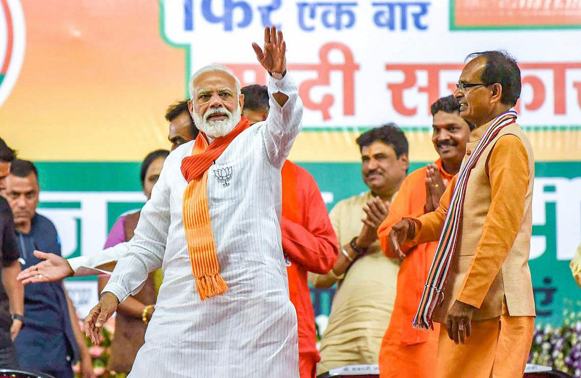 Prime Minister Narendra Modi waves at his supporters during an election campaign rally for the ongoing Lok Sabha polls, in Indore, Sunday, May 12, 2019. (PTI Photo)