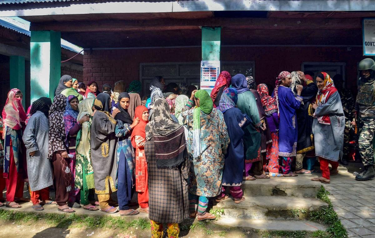 Women wait in long queues to cast their votes at a polling station, during the 4th phase of Lok Sabha elections, in Kulgam district of south Kashmir on April 29, 2019. (PTI Photo) 