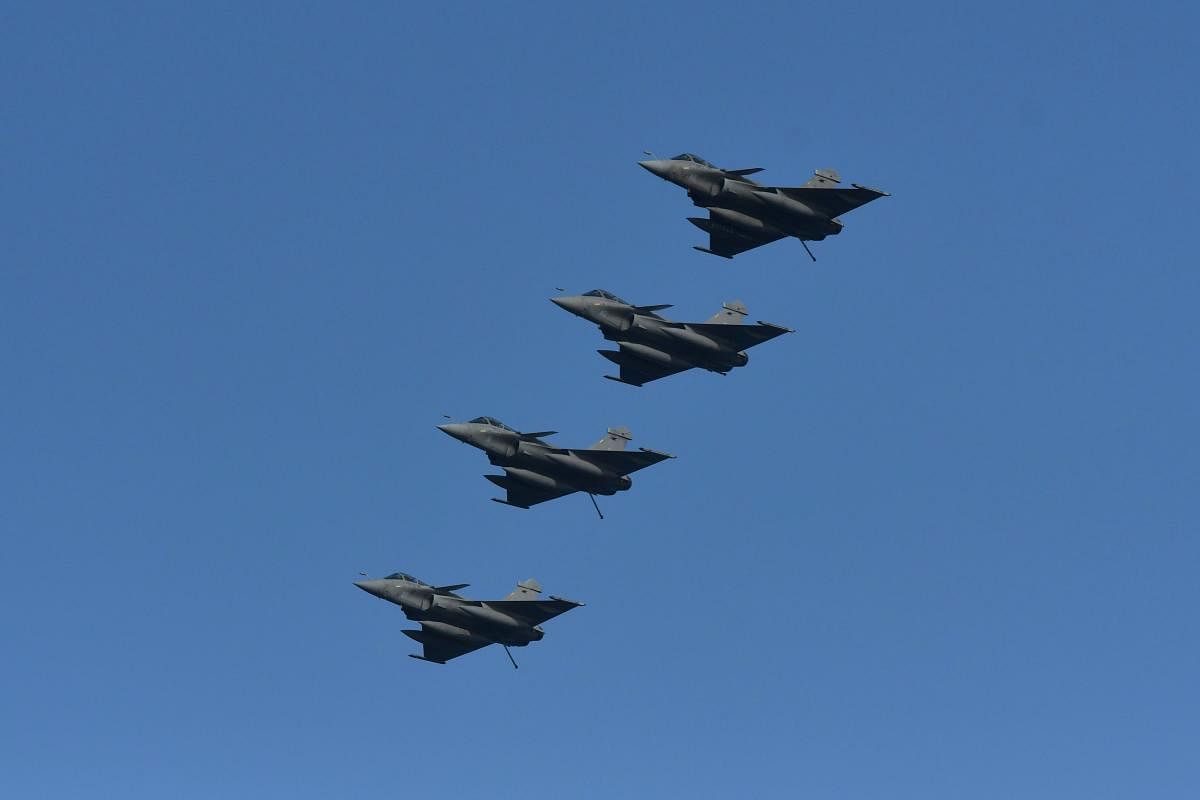 French Rafale fighter jets fly near the aircraft carrier "Charles de Gaulle" during a joint Indo-French naval exercise Varuna, in the Arabian sea, off Goa coast on May 9, 2019. AFP