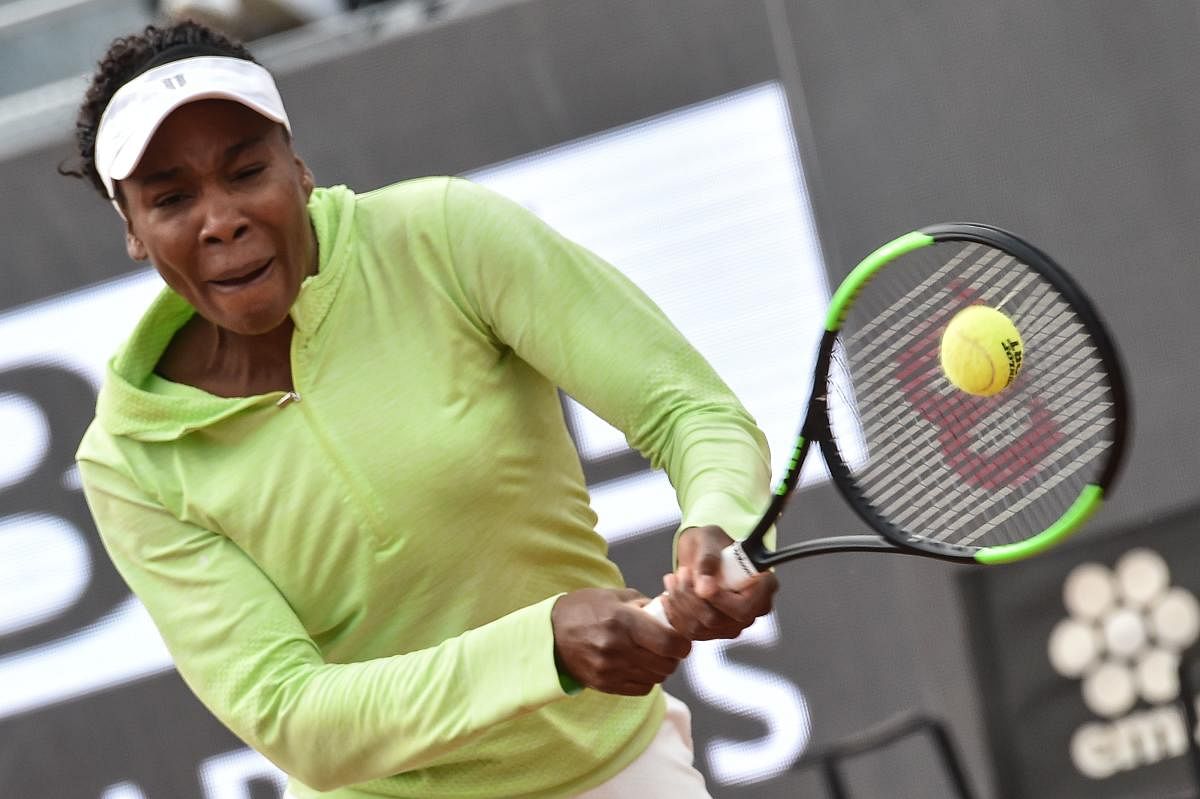 GUTSY: Venus Williams of the United States returns during her win over Belgium's Elise Mertens. AFP