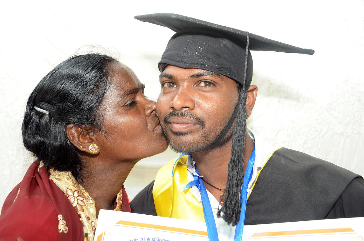 Devamma kisses her son Ramesh on his achievement.
