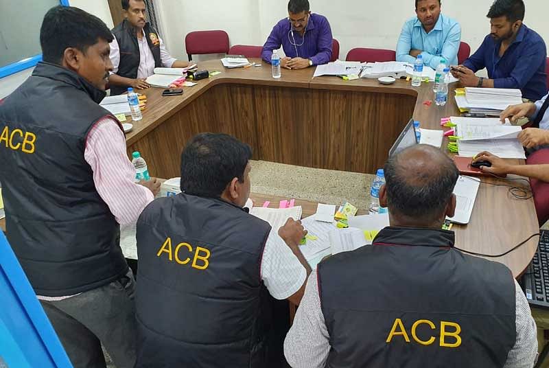 ACB sleuths search the premises of a co-operative bank in Bengaluru