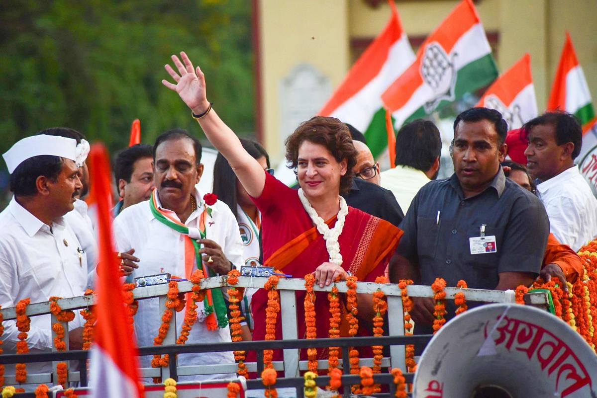 Congress general secretary Priyanka Gandhi Vadra (C) gestures along with other party leaders during a roadshow election campaign in Varanasi on Wednesday. AFP