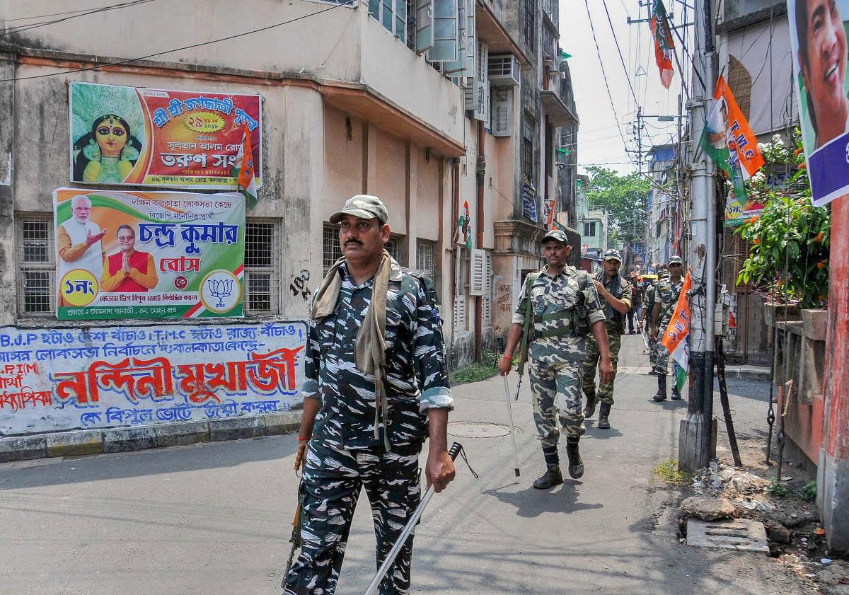 CRPF jawans conduct a route march ahead of the seventh and final phase of Lok Sabha elections, in Kolkata, Friday, May 17, 2019. (PTI Photo)