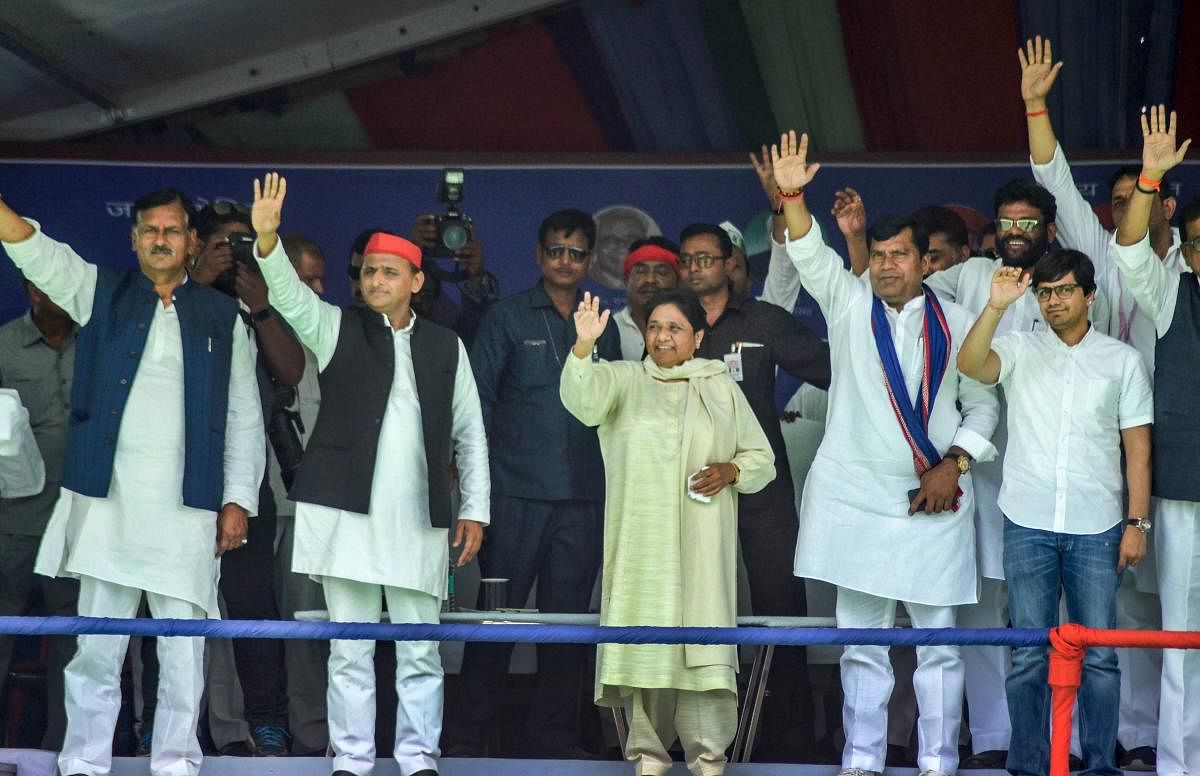 Samajwadi Party President Akhilesh Yadav and BSP chief Mayawati wave at their supporters during an election campaign rally for the seventh and last phase of Lok Sabha polls, in Mirzapur, May 17, 2019. (PTI Photo)