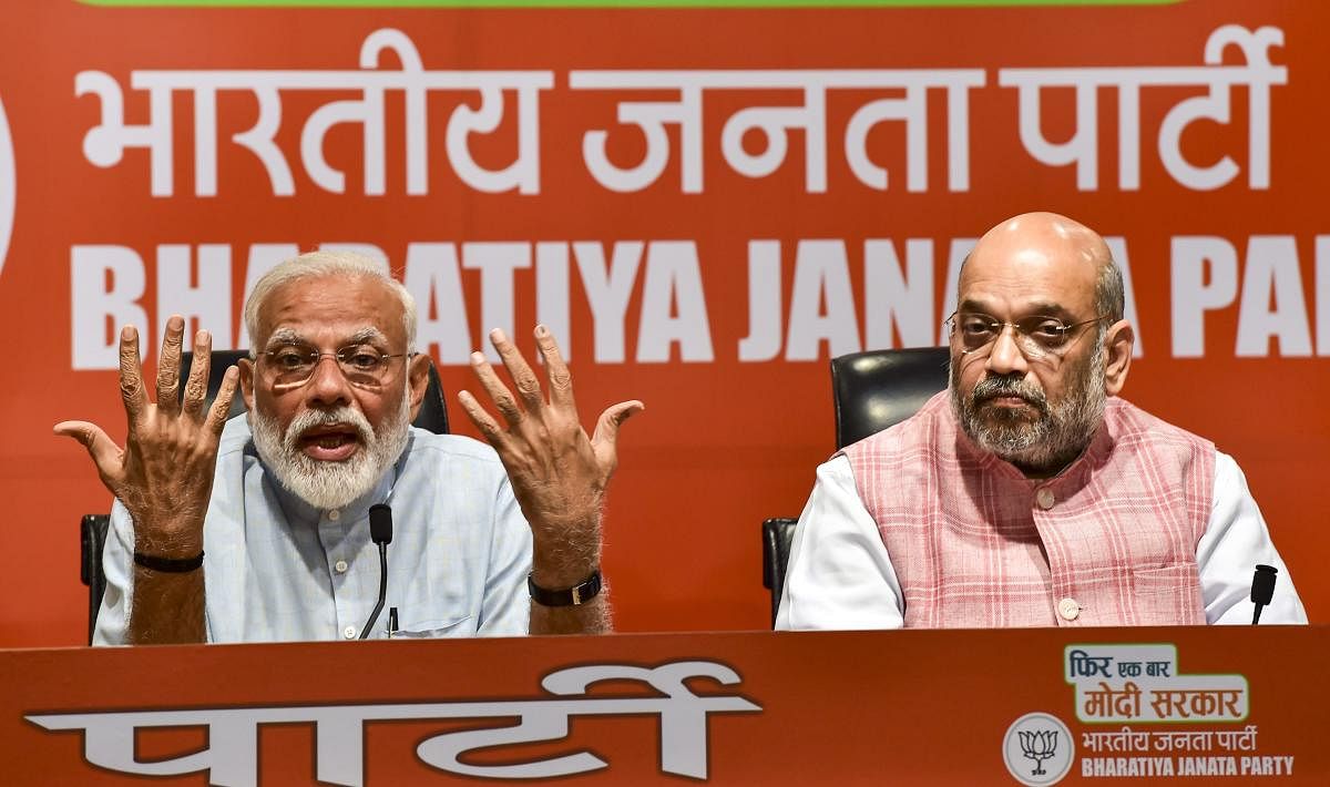 Prime Minister Narendra Modi and BJP president Amit Shah during a press conference in New Delhi on Friday. PTI