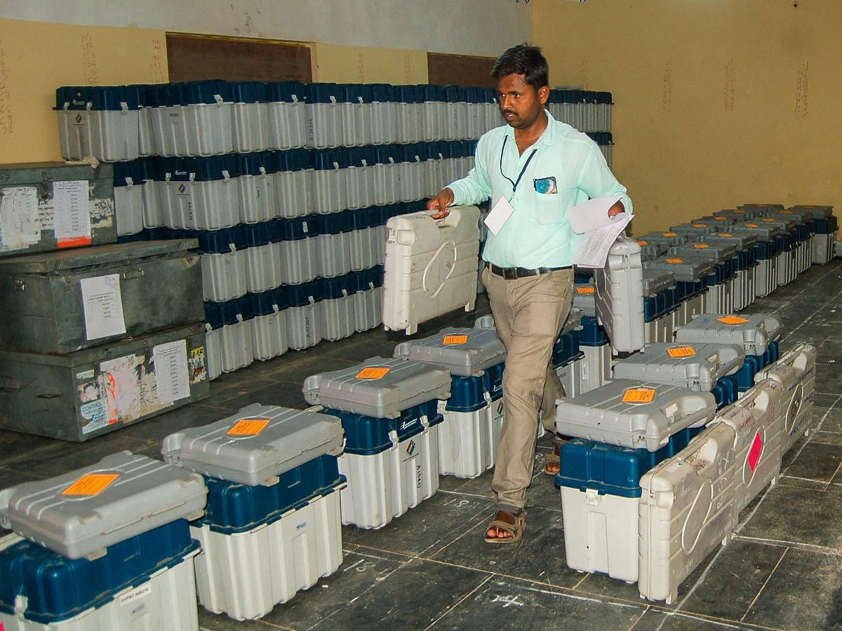 Kundgol: An election official inspects polling materials ahead of the byelection for Kundgol Assembly seat and the seventh and last phase of Lok Sabha polls, in Kundgol (PTI Photo)