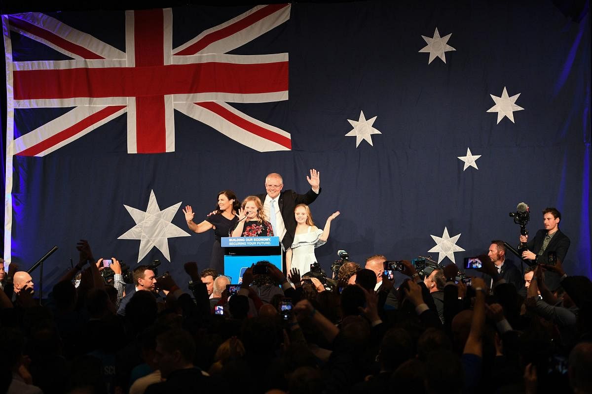 Australia's newly elected Prime Minister Scott Morrison (C) arrives to deliver a victory speech with his family after winning Australia's general election in Sydney on May 18, 2019. - Australia's ruling conservative coalition appeared to secure a shock el