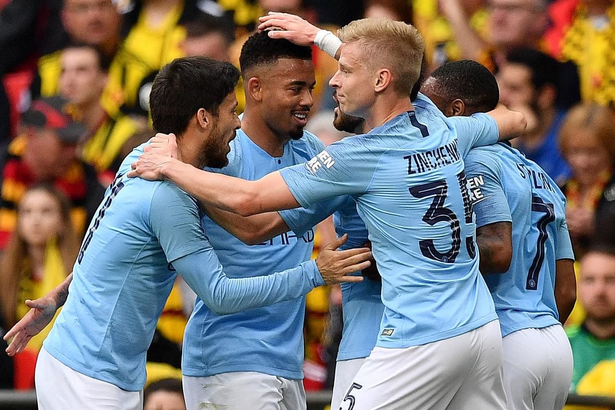 Manchester City’s Gabriel Jesus (second from left) celebrates with team-mates after scoring against Watford in the FA Cup final. AFP