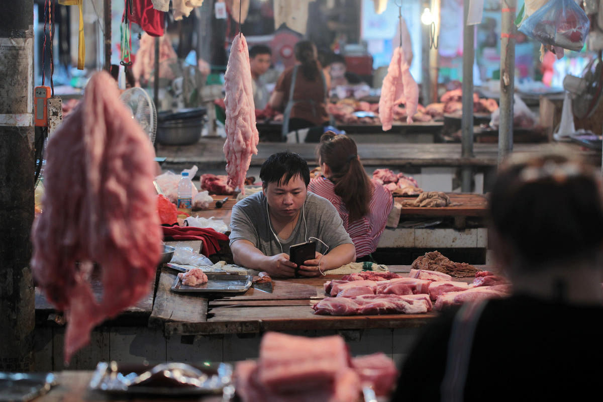 China's struggle with outbreaks of a deadly swine disease sends shockwaves through global meat markets. Reuters file photo