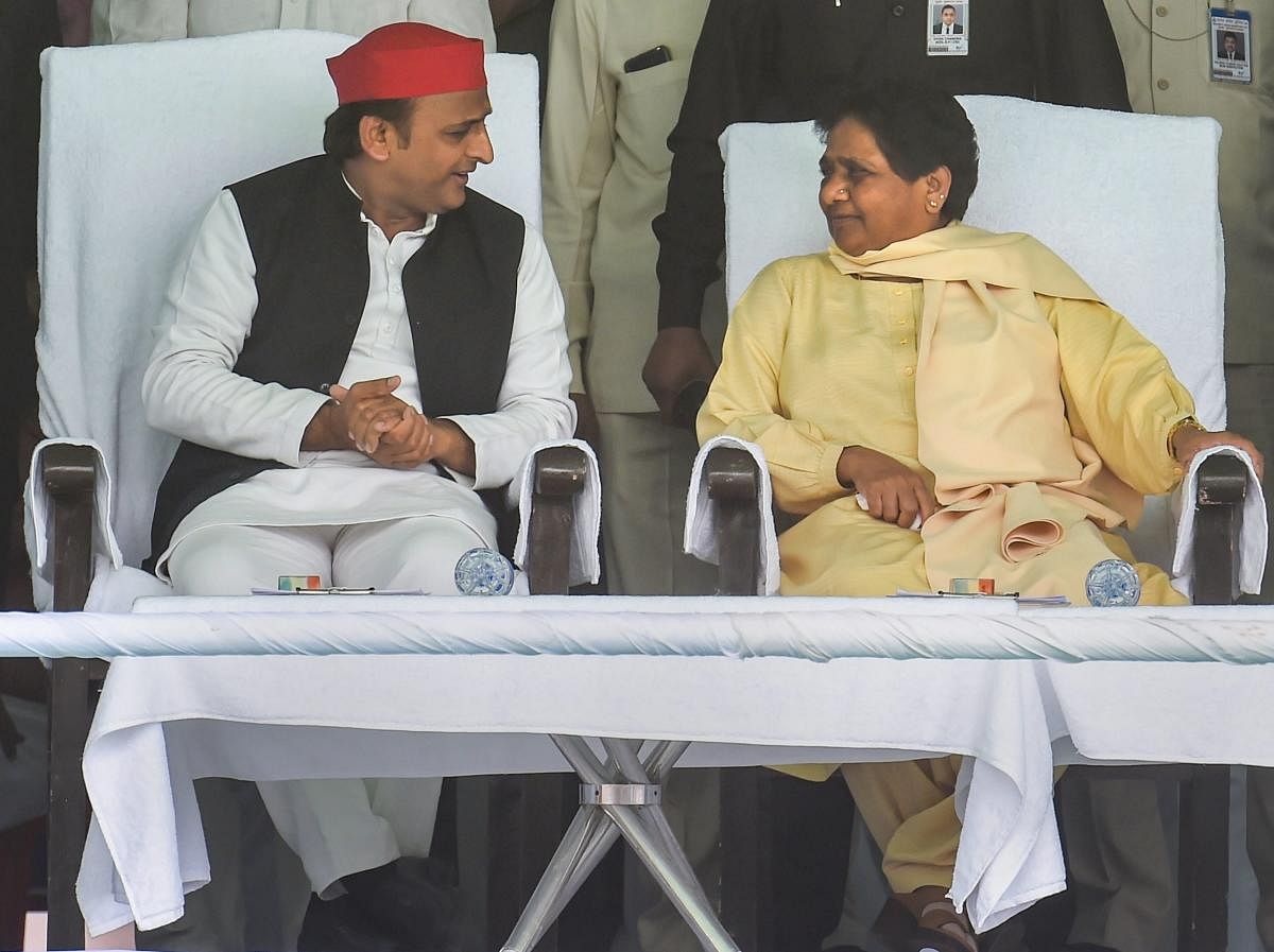 Bahujan Samajwadi Party chief Mayawati with Samajwadi Party chief Akhilesh Yadav. (PTI File Photo)