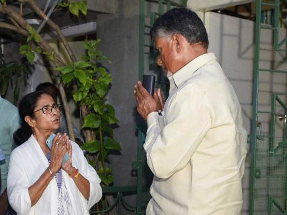 Andhra Pradesh Chief Minister and Telugu Desam Party President N Chandrababu Naidu greets West Bengal Chief Minister and Trinamool Congress chief Mamata Banerjee, at her residence in Kolkata. PTI photo