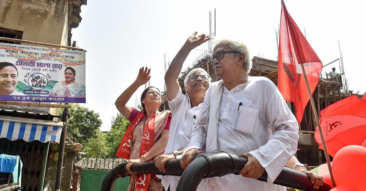 Left Front Chairman Biman Bose(R) and party leader Sujan Chakraborty (C) participate in an election campaign in support of CPI(M)'s South Kolkata candidate Nandini Mukherjee for the Lok Sabha polls, Kolkata on April 28, 2019. (PTI Photo)