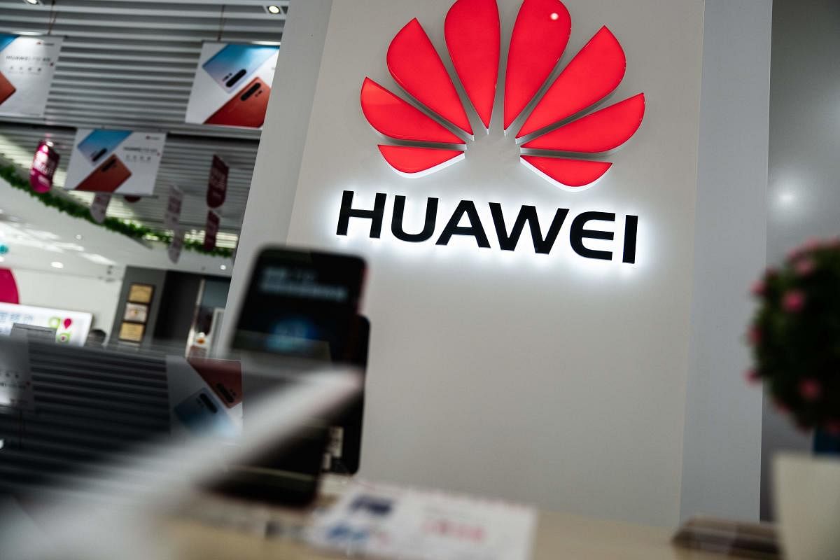 A Huawei logo is displayed at a retail store in Beijing on May 20, 2019. (AFP)
