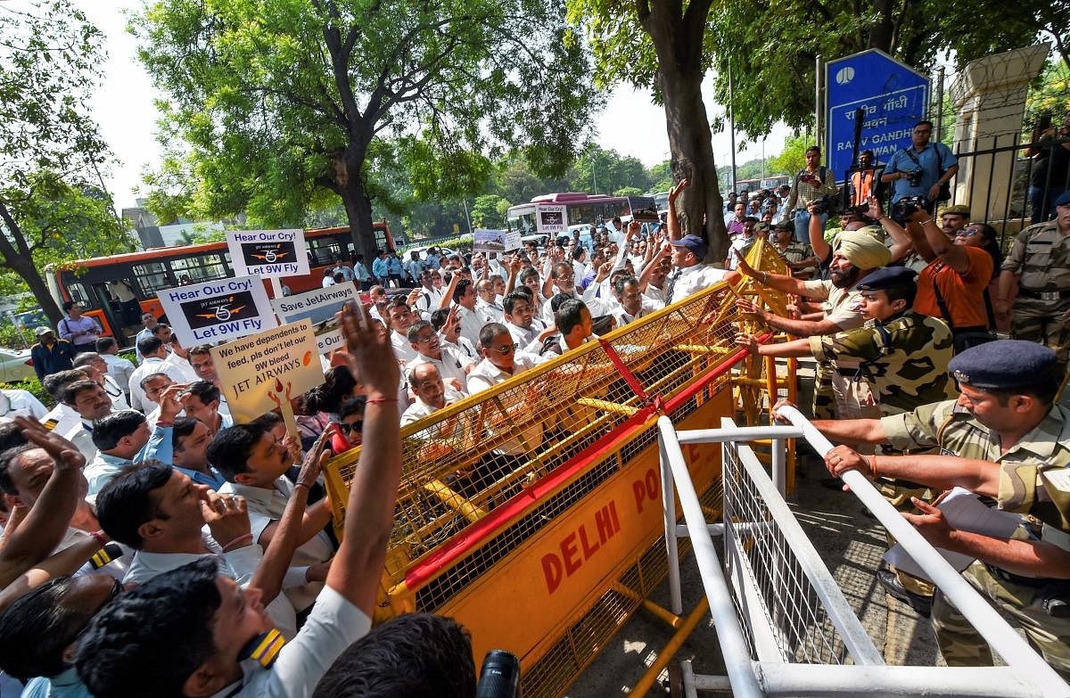 New Delhi: Jet Airways employees hold placards and raise slogans during a protest appealing the government's interference to save the debt-laden airlines, outside Civil Aviation Ministry, at Rajiv Gandhi Bhawan in New Delhi. (PTI Photo)
