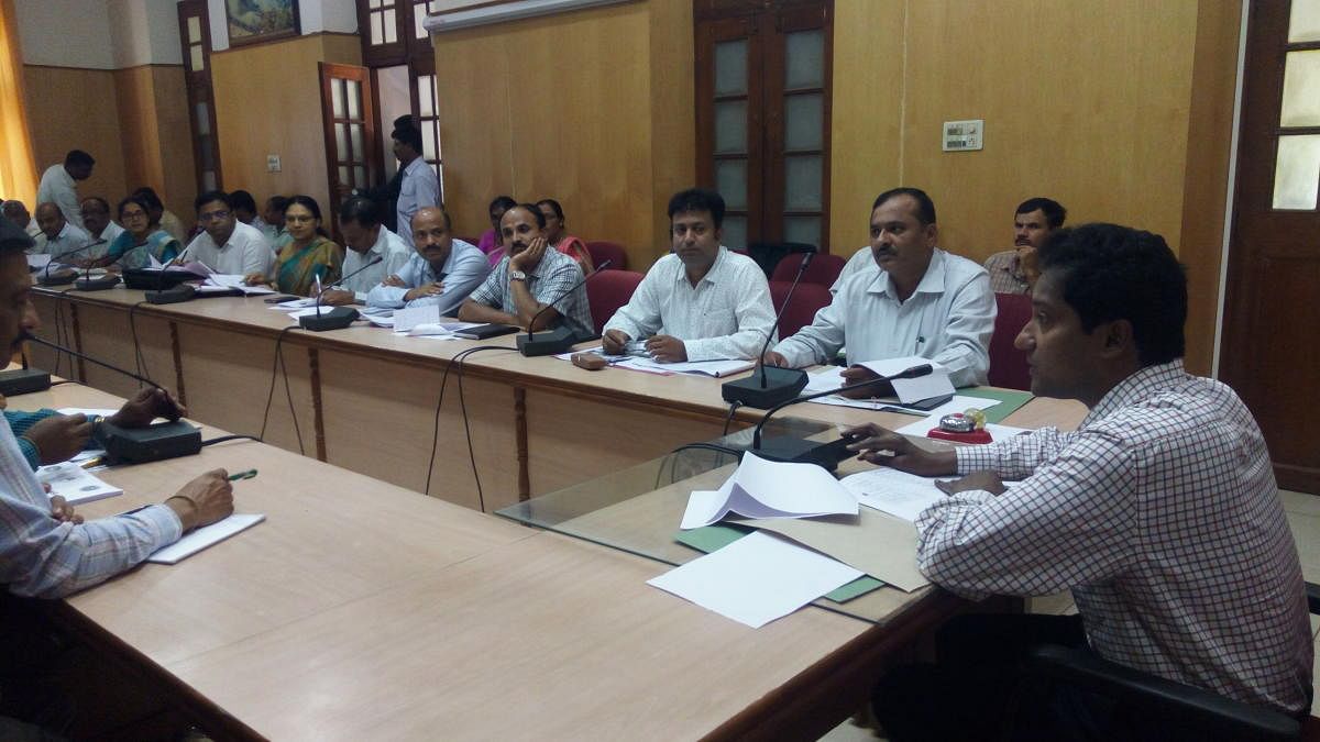 Deputy Commissioner Dr Bagadi Gautam chairs a meeting at his office in Chikkamagaluru on Tuesday, to discuss the preventive measures against the spread of communicable diseases.
