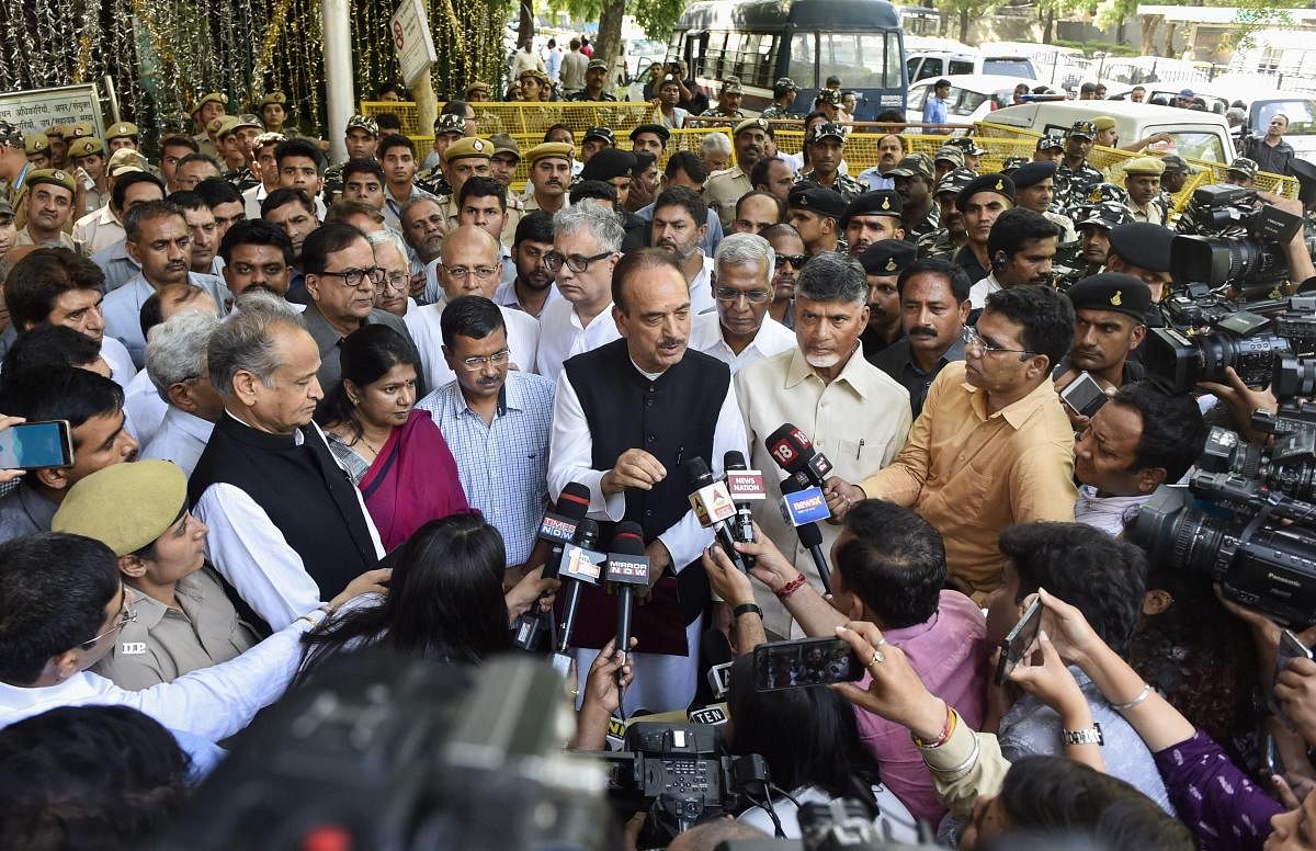 Senior Congress leader Ghulam Nabi Azad with Andhra Pradesh CM and TDP President N Chandrababu Naidu, Delhi Chief Minister Arvind Kejriwal, TMC's Derek O' Brien, DMK's Kanimozhi, CPI's D Raja and other opposition leaders addresses the media after meeting the Election Commission over their concerns about Electronic Voting Machines and the VVPAT (Voter Verified Paper Trail Machines), at Nirvachan Sadan, in New Delhi, Tuesday, May 21, 2019. (PTI Photo)