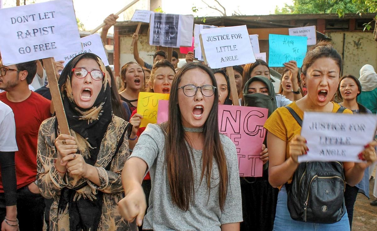 College students raise slogans during a protest against the alleged rape of a three-year-old girl by a local in Bandipora district of Jammu and Kashmir, in Jammu. (PTI Photo)